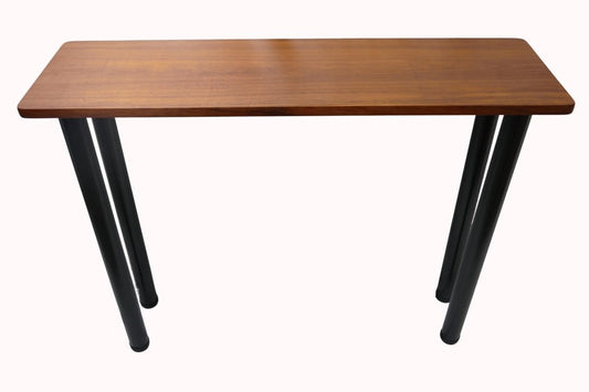 a wooden table sitting on top of a white backdrop