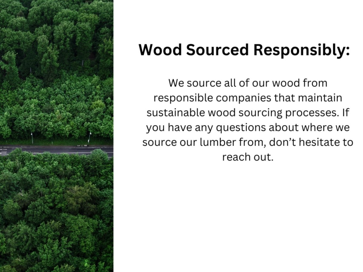 an aerial view of a road surrounded by trees