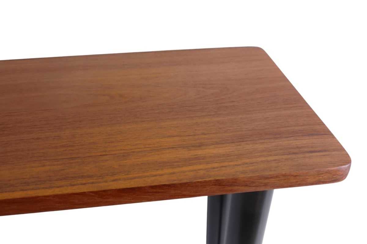 a close up of a wooden table with metal legs