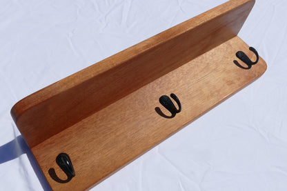 Mahogany coat rack with shelf and black coat hooks