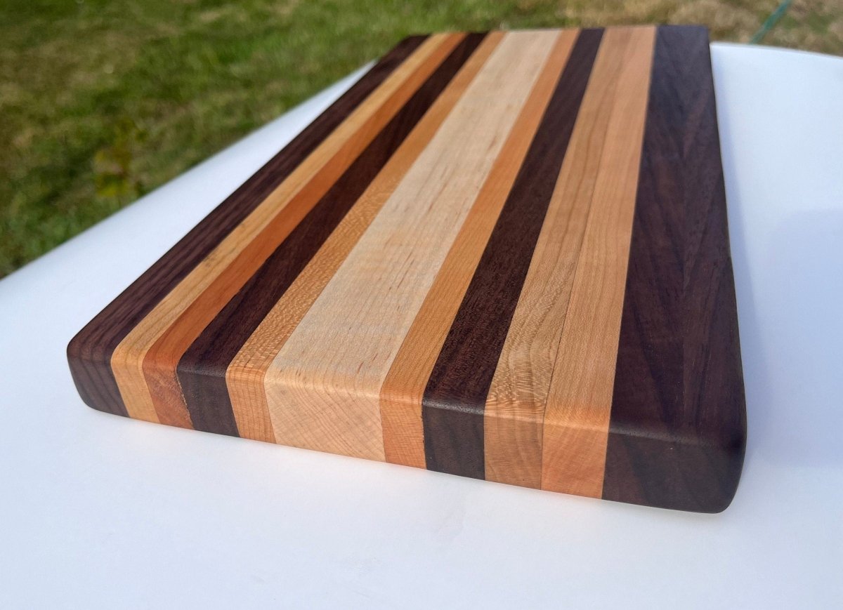 Edge Grain Cutting Board made of cherry, walnut, and curly soft maple - Woodwork & Design by AJ