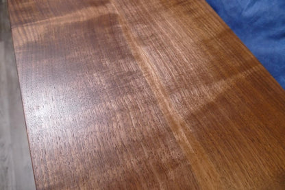 a close up of a wooden figured black walnut table top