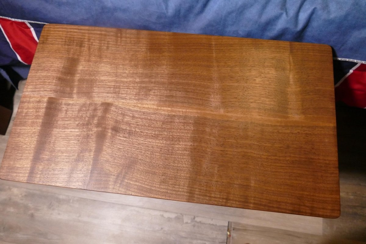 a close up of a figured walnut wooden table top