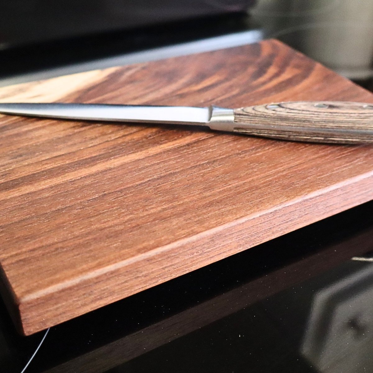 walnut cutting board with knife